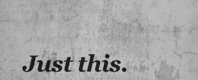 "Just this" text on grey, polished concrete background