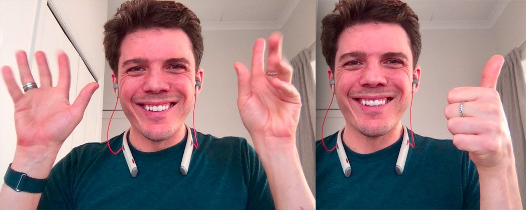 Chris smiling with both hands up, fingers wiggling, then a thumbs up: enthusiasm or agreement.