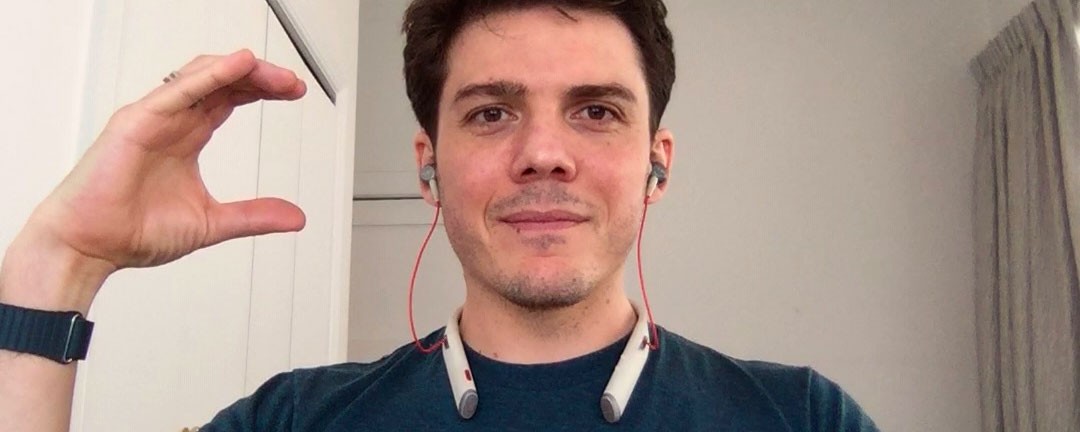 Chris holding one hand in a C shape to the camera: a clarifying question or comment.